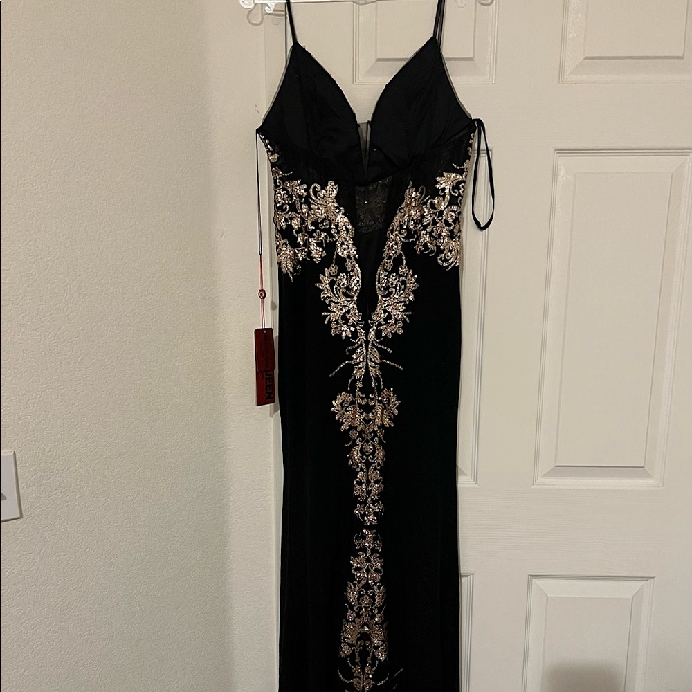 Black Prom Dress with Gold detailing and Slit. Message for more info.